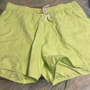 green swim shorts/ cover